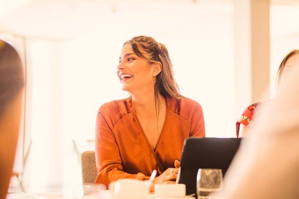 young professional laughing at work