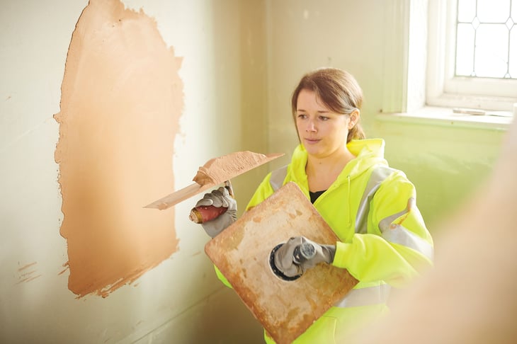 An operative patch plastering as available on Fusion21’s Reactive Repairs and Empty Buildings Framework